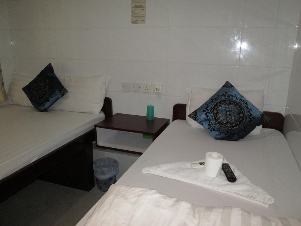 Global Inn Цзюлун Экстерьер фото