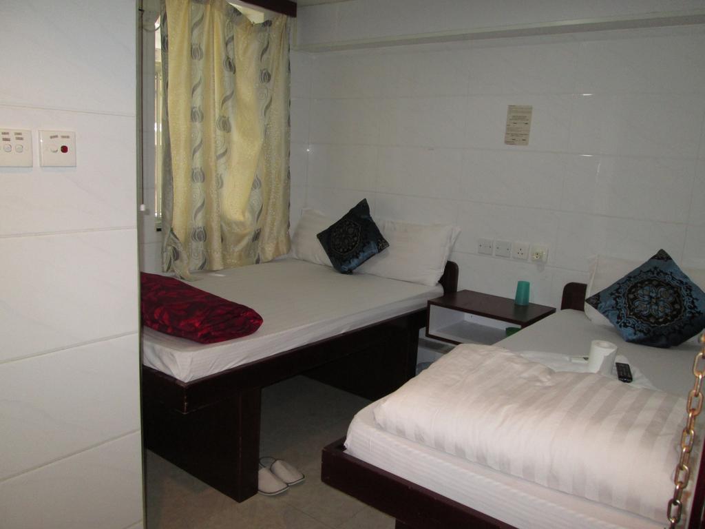Global Inn Цзюлун Экстерьер фото